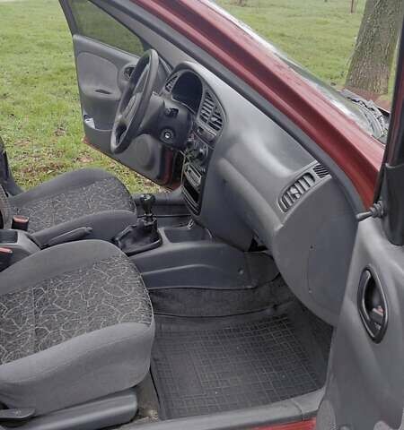 Красный Дэу Ланос, объемом двигателя 1.5 л и пробегом 230 тыс. км за 2600 $, фото 8 на Automoto.ua