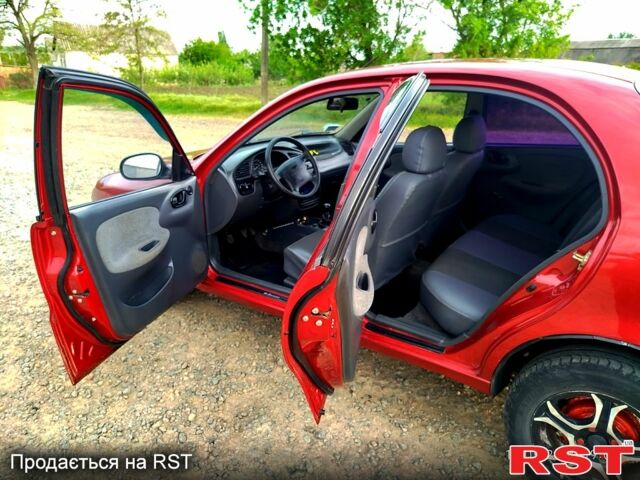 Красный Дэу Ланос, объемом двигателя 1.6 л и пробегом 188 тыс. км за 2350 $, фото 8 на Automoto.ua