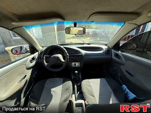 Красный Дэу Ланос, объемом двигателя 1.5 л и пробегом 250 тыс. км за 1550 $, фото 1 на Automoto.ua