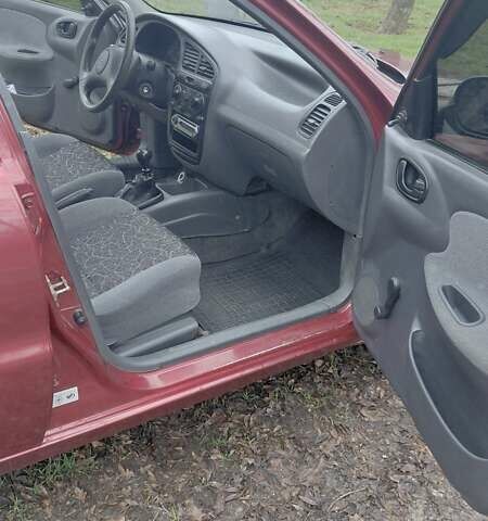 Красный Дэу Ланос, объемом двигателя 1.5 л и пробегом 230 тыс. км за 2600 $, фото 13 на Automoto.ua