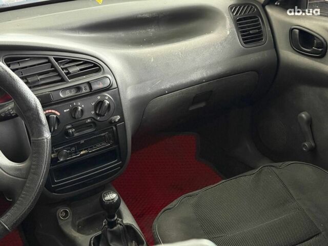 Красный Дэу Ланос, объемом двигателя 1.5 л и пробегом 305 тыс. км за 2440 $, фото 14 на Automoto.ua