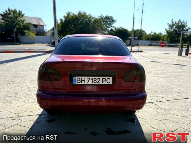 Красный Дэу Ланос, объемом двигателя 1.5 л и пробегом 250 тыс. км за 1550 $, фото 10 на Automoto.ua