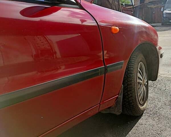 Червоний Деу Ланос, об'ємом двигуна 1.5 л та пробігом 268 тис. км за 1950 $, фото 20 на Automoto.ua