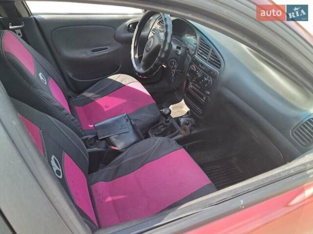 Красный Дэу Ланос, объемом двигателя 1.5 л и пробегом 270 тыс. км за 2100 $, фото 2 на Automoto.ua