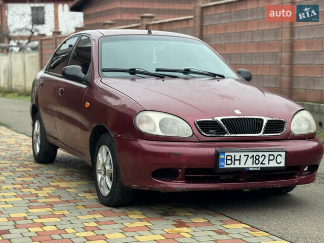 Красный Дэу Ланос, объемом двигателя 1.5 л и пробегом 270 тыс. км за 1400 $, фото 2 на Automoto.ua