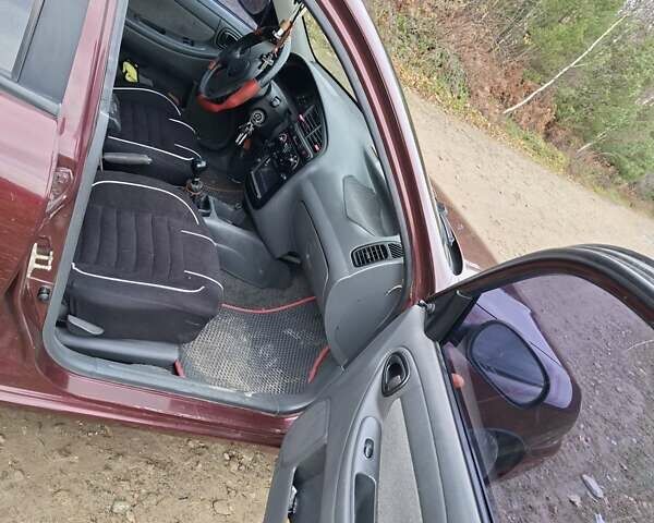 Красный Дэу Ланос, объемом двигателя 1.5 л и пробегом 211 тыс. км за 2800 $, фото 4 на Automoto.ua