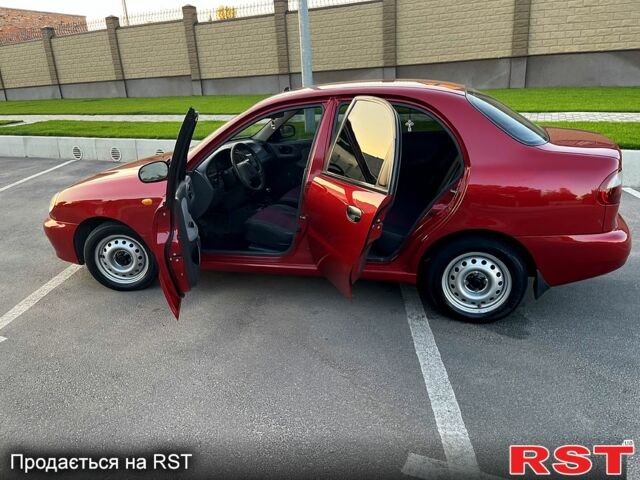 Красный Дэу Ланос, объемом двигателя 1.4 л и пробегом 150 тыс. км за 2700 $, фото 2 на Automoto.ua
