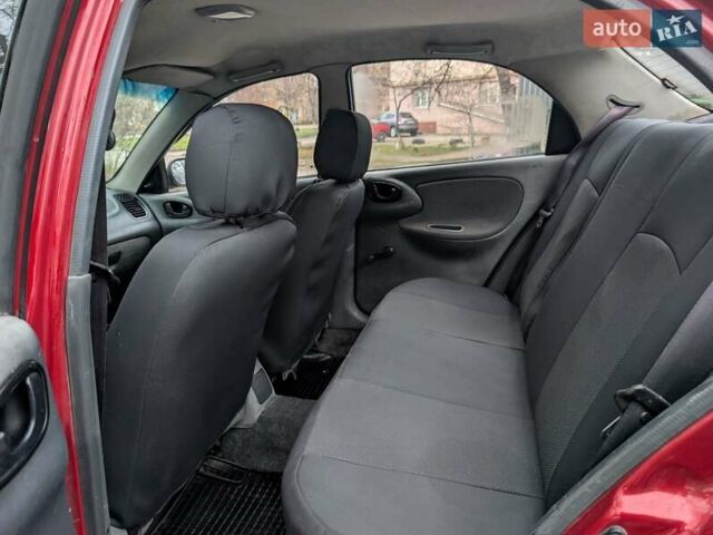 Красный Дэу Ланос, объемом двигателя 1.4 л и пробегом 156 тыс. км за 1950 $, фото 10 на Automoto.ua