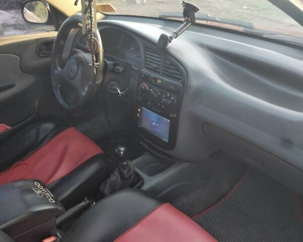 Красный Дэу Ланос, объемом двигателя 1.4 л и пробегом 190 тыс. км за 2200 $, фото 2 на Automoto.ua