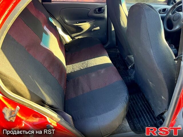 Красный Дэу Ланос, объемом двигателя 1.4 л и пробегом 126 тыс. км за 1500 $, фото 11 на Automoto.ua