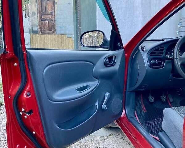 Красный Дэу Ланос, объемом двигателя 1.4 л и пробегом 103 тыс. км за 2700 $, фото 8 на Automoto.ua
