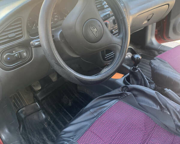 Красный Дэу Ланос, объемом двигателя 1.5 л и пробегом 144 тыс. км за 3000 $, фото 5 на Automoto.ua