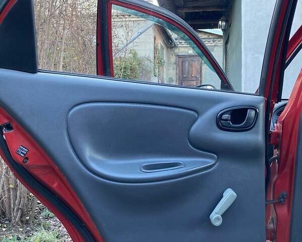 Красный Дэу Ланос, объемом двигателя 1.4 л и пробегом 103 тыс. км за 2700 $, фото 5 на Automoto.ua