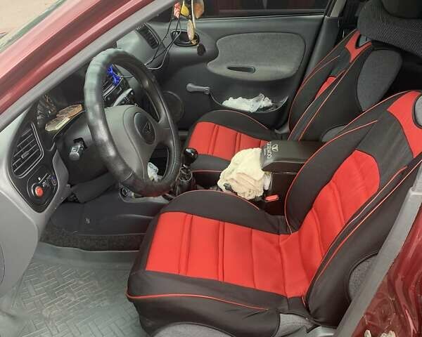 Красный Дэу Ланос, объемом двигателя 1.5 л и пробегом 170 тыс. км за 3700 $, фото 6 на Automoto.ua