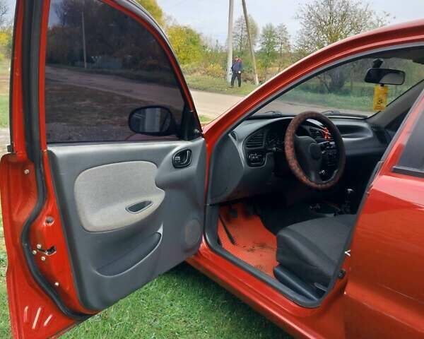 Деу Ланос 2008 у Богодухове на Automoto.ua Червоний Деу Ланос, об'ємом двигуна 1.5 л та пробігом 153 тис. км за 2600 $, фото 4 на Automoto.ua