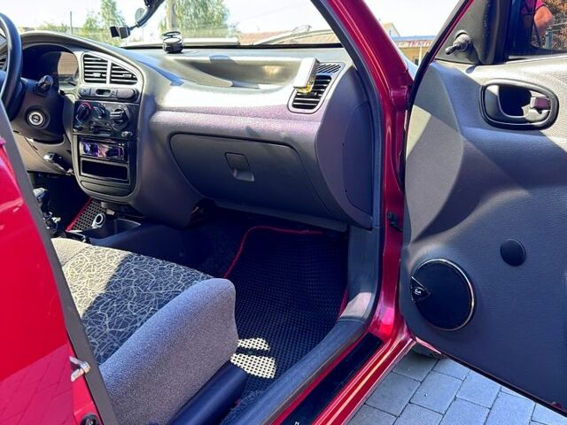 Красный Дэу Ланос, объемом двигателя 1.4 л и пробегом 112 тыс. км за 3000 $, фото 6 на Automoto.ua