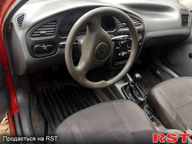 Красный Дэу Ланос, объемом двигателя 1.4 л и пробегом 93 тыс. км за 2300 $, фото 4 на Automoto.ua