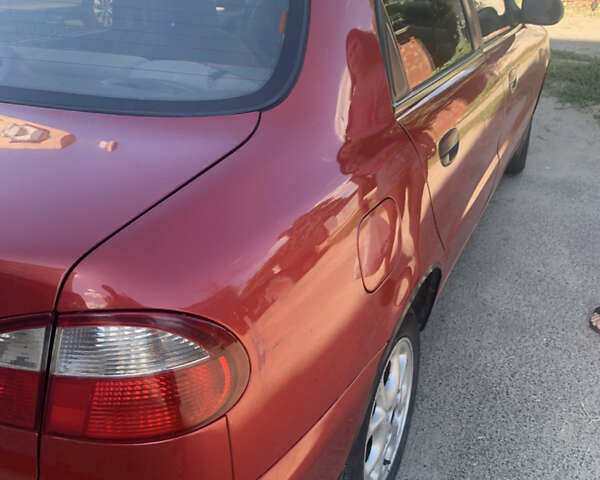 Красный Дэу Ланос, объемом двигателя 1.5 л и пробегом 144 тыс. км за 3000 $, фото 3 на Automoto.ua