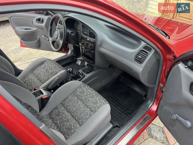 Красный Дэу Ланос, объемом двигателя 1.4 л и пробегом 44 тыс. км за 3300 $, фото 13 на Automoto.ua