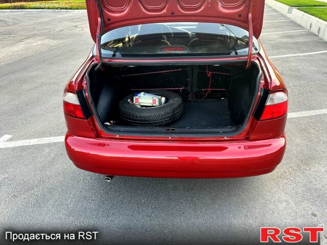 Красный Дэу Ланос, объемом двигателя 1.4 л и пробегом 150 тыс. км за 2700 $, фото 5 на Automoto.ua