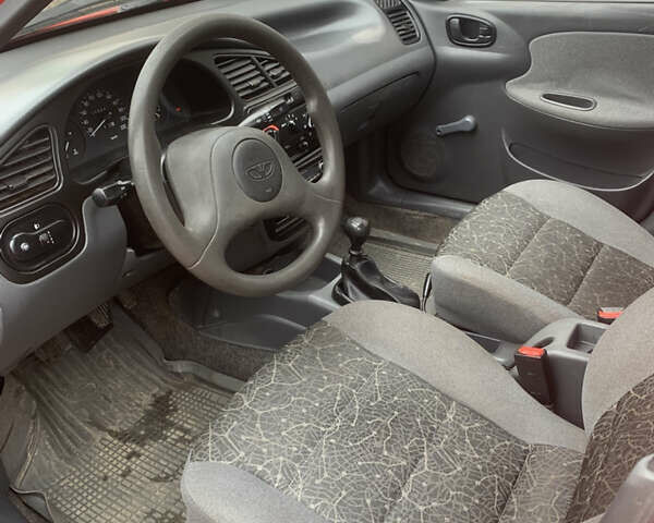 Красный Дэу Ланос, объемом двигателя 1.4 л и пробегом 73 тыс. км за 1750 $, фото 15 на Automoto.ua