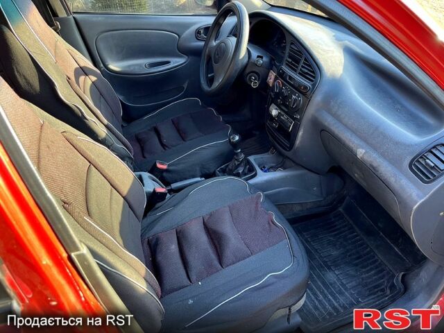 Красный Дэу Ланос, объемом двигателя 1.4 л и пробегом 126 тыс. км за 1500 $, фото 12 на Automoto.ua