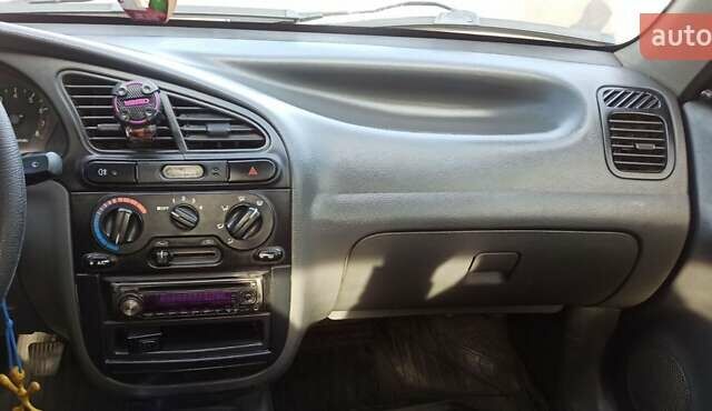 Красный Дэу Ланос, объемом двигателя 1.5 л и пробегом 437 тыс. км за 2150 $, фото 4 на Automoto.ua