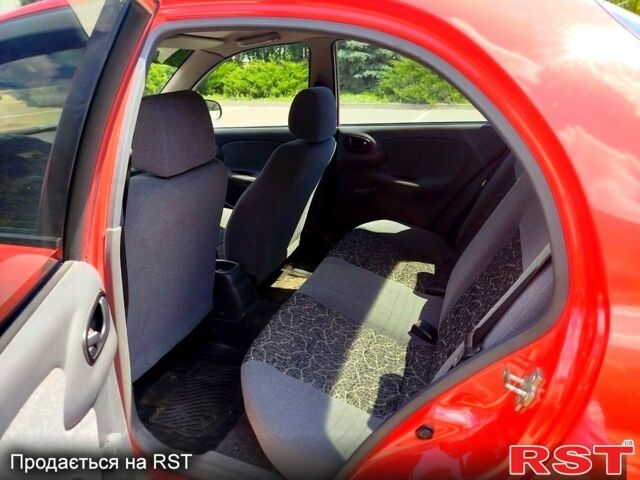 Красный Дэу Ланос, объемом двигателя 1.5 л и пробегом 158 тыс. км за 3500 $, фото 6 на Automoto.ua