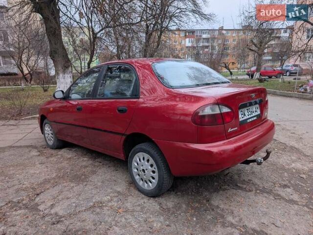 Красный Дэу Ланос, объемом двигателя 1.4 л и пробегом 156 тыс. км за 1950 $, фото 7 на Automoto.ua