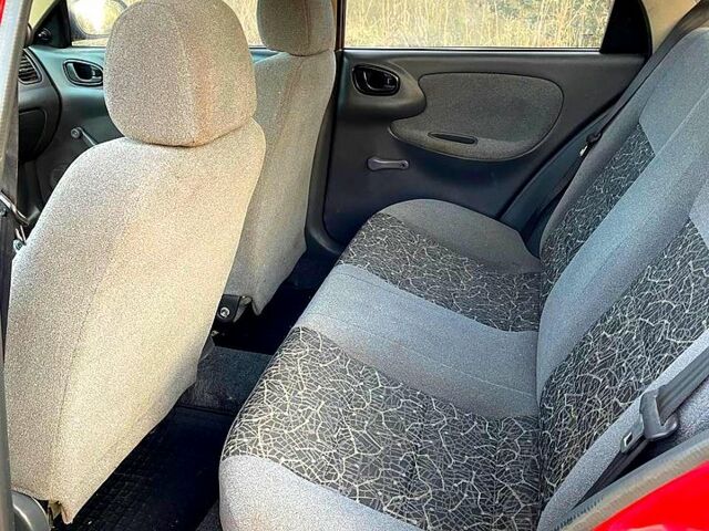 Красный Дэу Ланос, объемом двигателя 1.4 л и пробегом 95 тыс. км за 1999 $, фото 5 на Automoto.ua