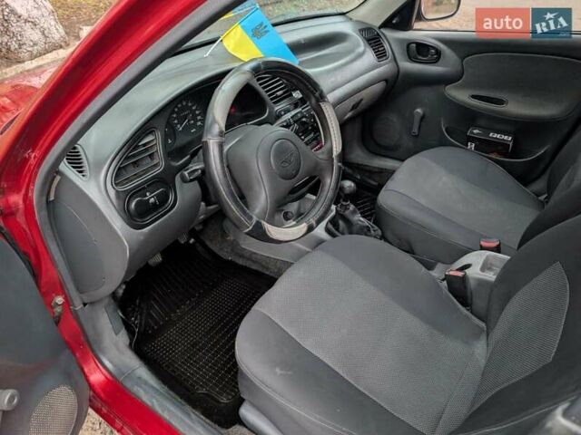 Красный Дэу Ланос, объемом двигателя 1.4 л и пробегом 156 тыс. км за 1950 $, фото 12 на Automoto.ua