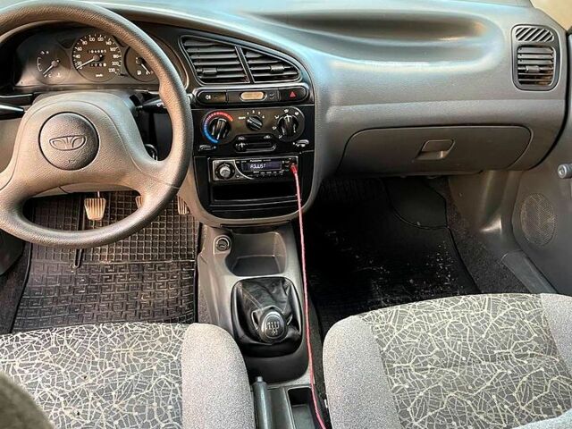 Красный Дэу Ланос, объемом двигателя 1.4 л и пробегом 95 тыс. км за 1999 $, фото 4 на Automoto.ua