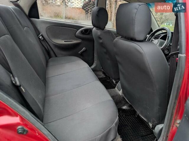 Красный Дэу Ланос, объемом двигателя 1.4 л и пробегом 156 тыс. км за 1950 $, фото 11 на Automoto.ua