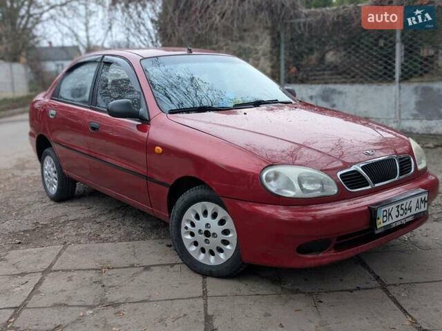 Красный Дэу Ланос, объемом двигателя 1.4 л и пробегом 156 тыс. км за 1950 $, фото 5 на Automoto.ua