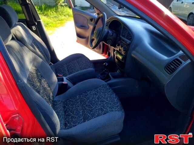 Красный Дэу Ланос, объемом двигателя 1.4 л и пробегом 170 тыс. км за 2300 $, фото 5 на Automoto.ua