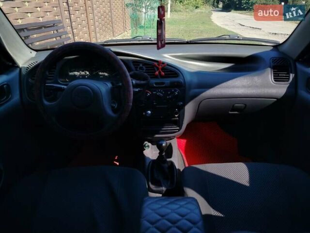 Деу Ланос 2008 у Богодухове на Automoto.ua Червоний Деу Ланос, об'ємом двигуна 1.5 л та пробігом 153 тис. км за 2600 $, фото 16 на Automoto.ua