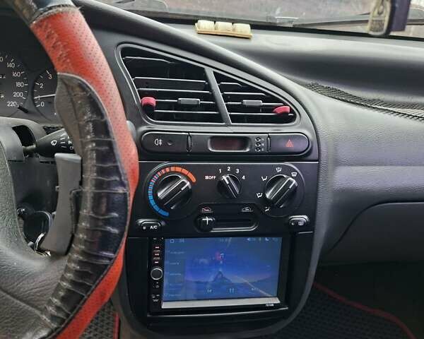 Красный Дэу Ланос, объемом двигателя 1.5 л и пробегом 211 тыс. км за 2800 $, фото 8 на Automoto.ua