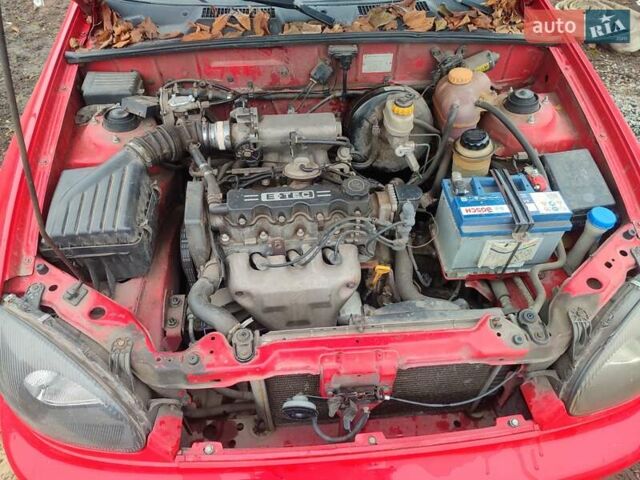 Красный Дэу Ланос, объемом двигателя 1.5 л и пробегом 197 тыс. км за 2400 $, фото 11 на Automoto.ua