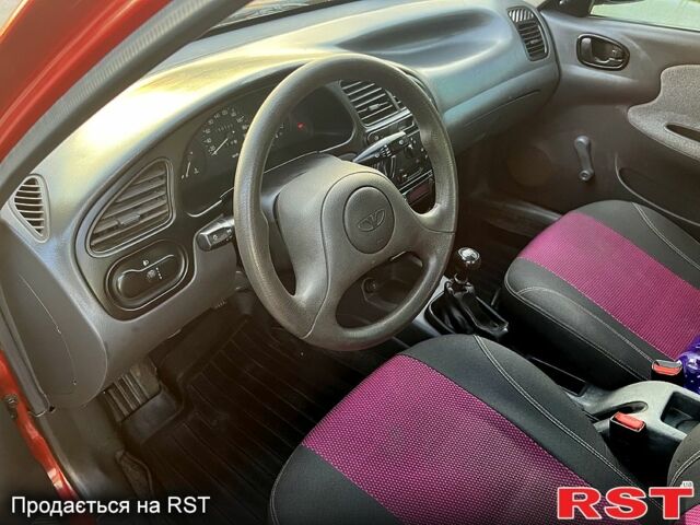 Красный Дэу Ланос, объемом двигателя 1.4 л и пробегом 150 тыс. км за 2700 $, фото 7 на Automoto.ua