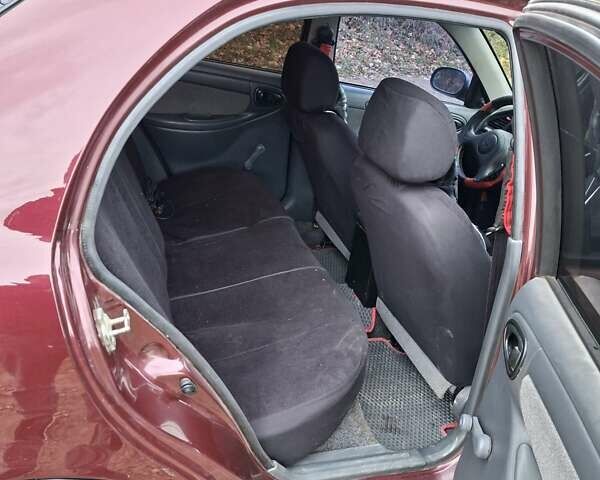 Красный Дэу Ланос, объемом двигателя 1.5 л и пробегом 211 тыс. км за 2800 $, фото 5 на Automoto.ua