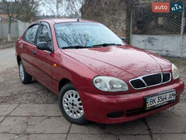 Красный Дэу Ланос, объемом двигателя 1.4 л и пробегом 156 тыс. км за 1950 $, фото 4 на Automoto.ua