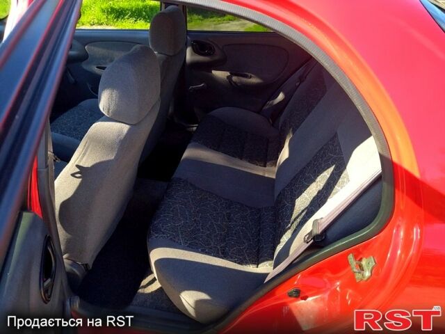 Красный Дэу Ланос, объемом двигателя 1.4 л и пробегом 170 тыс. км за 2300 $, фото 6 на Automoto.ua