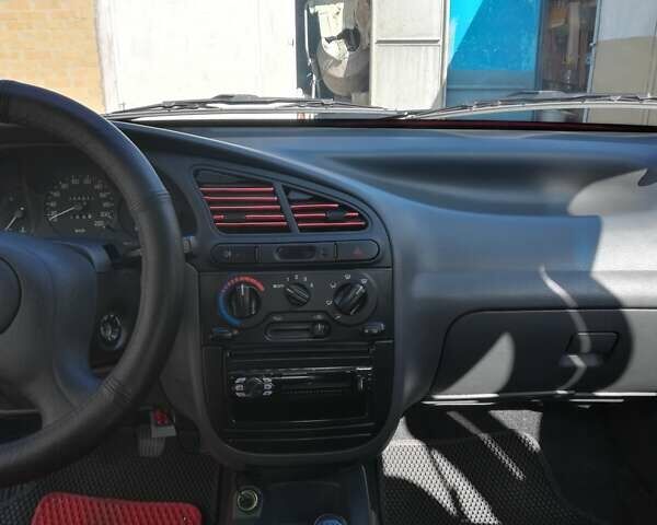 Красный Дэу Ланос, объемом двигателя 1.5 л и пробегом 34 тыс. км за 4200 $, фото 3 на Automoto.ua