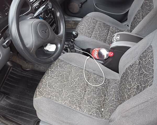 Красный Дэу Ланос, объемом двигателя 1.5 л и пробегом 210 тыс. км за 1800 $, фото 5 на Automoto.ua