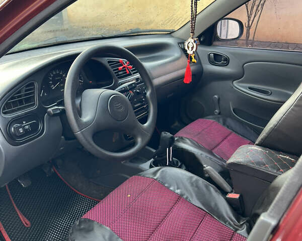 Красный Дэу Ланос, объемом двигателя 1.6 л и пробегом 179 тыс. км за 2099 $, фото 8 на Automoto.ua