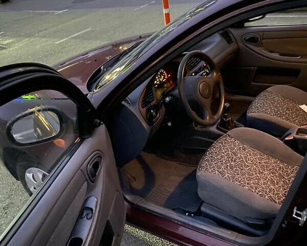 Красный Дэу Ланос, объемом двигателя 1.5 л и пробегом 150 тыс. км за 2500 $, фото 2 на Automoto.ua