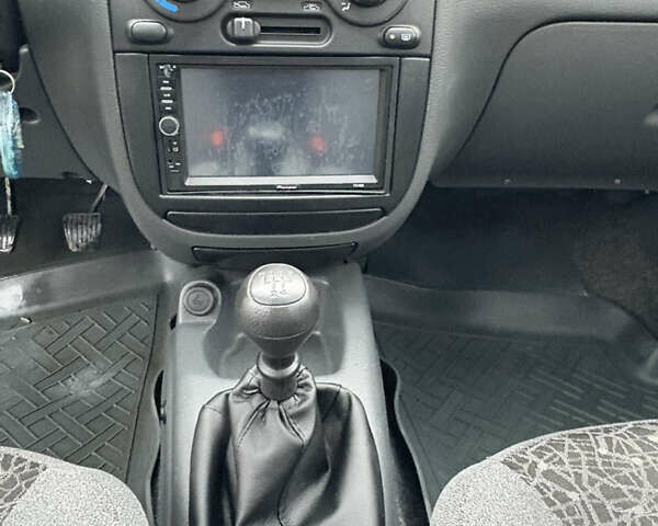 Красный Дэу Ланос, объемом двигателя 1.5 л и пробегом 74 тыс. км за 3400 $, фото 17 на Automoto.ua