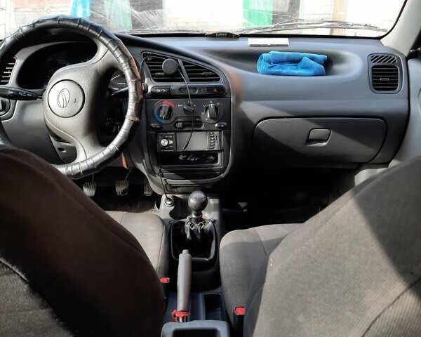 Красный Дэу Ланос, объемом двигателя 1.5 л и пробегом 168 тыс. км за 3000 $, фото 8 на Automoto.ua