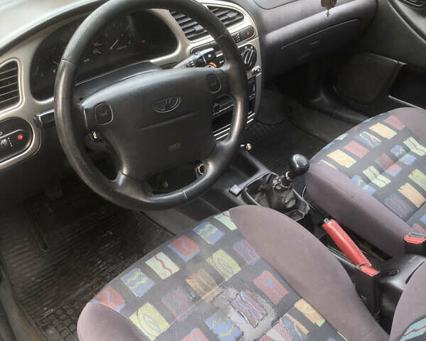 Желтый Дэу Ланос, объемом двигателя 1.6 л и пробегом 215 тыс. км за 2500 $, фото 7 на Automoto.ua