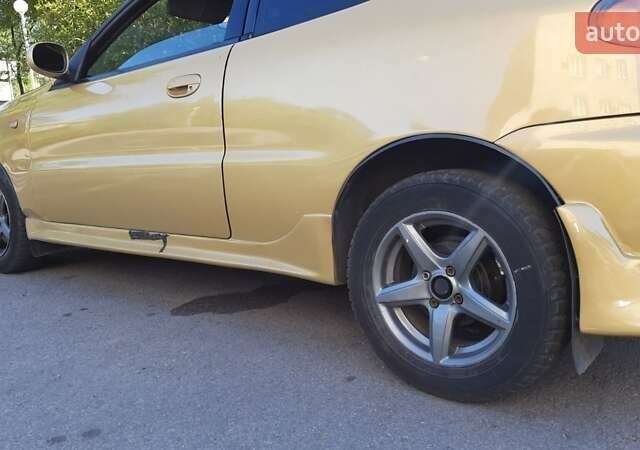 Дэу Ланос 2003 в Запорожье на Automoto.ua Желтый Дэу Ланос, объемом двигателя 1.6 л и пробегом 243 тыс. км за 1700 $, фото 1 на Automoto.ua